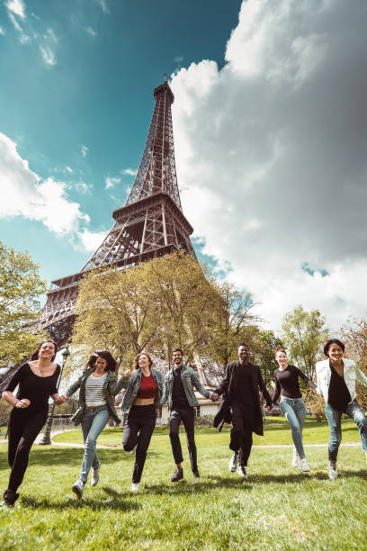 istock happiness student jumping all together in paris 1270022672