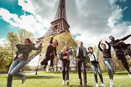 happiness student jumping all together in paris