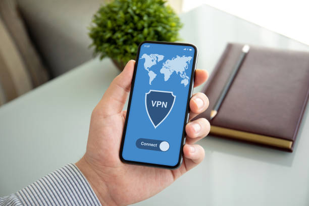 istock male hands holding phone with app vpn on the screen 1270022839