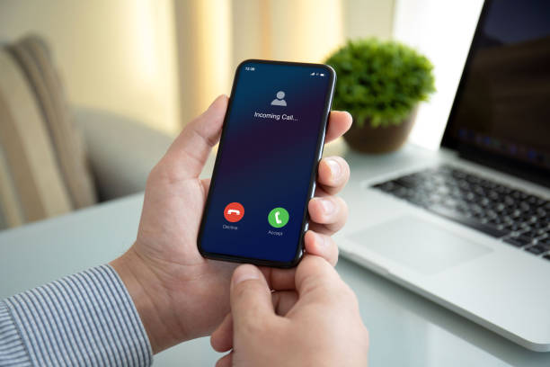 istock male hands holding phone with incoming call on the screen 1270023638