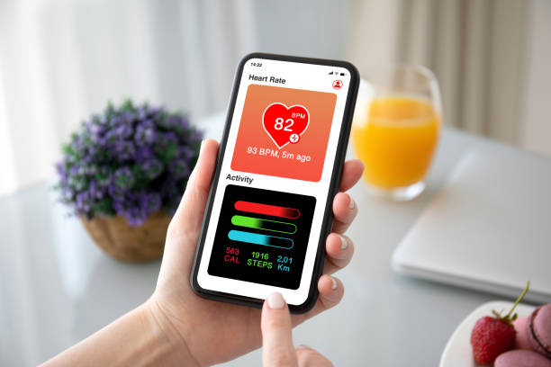 istock female hands holding phone with app heart and activity 1270024000