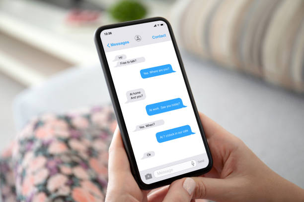 istock female hands holding phone with app messenger on the screen 1270024174