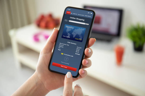istock female hands holding phone with app online shopping on screen 1270024807