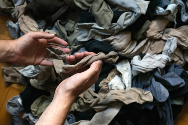 Declutter and tidying up concept.  Clearing a messy clutter of old clothes.