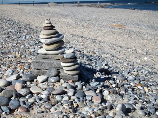 two cairns (stack of stones) at the beach of Düne (Dune) island at the archipelago of Heligoland, Germany