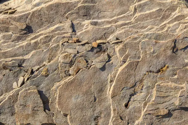 sunny illuminated full frame abstract stone surface