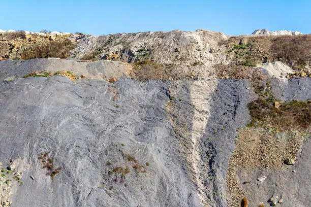 spoil pile hillslope with gravel and stones in sunny ambiance