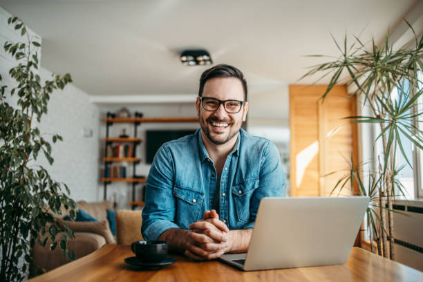 Portrait of a happy freelancer at home office. Portrait of a happy freelancer at home office. 30 34 years stock pictures, royalty-free photos & images