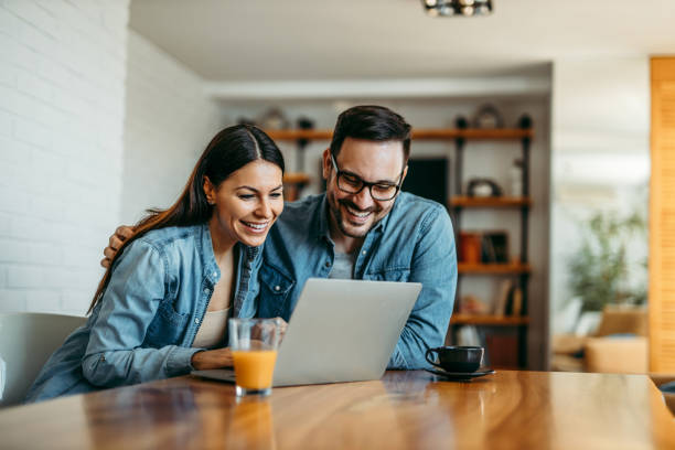 istock Loving couple hugging and looking at laptop, portrait. 1270030236