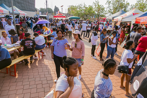 Soweto, South Africa - September 17, 2017: Diverse African people at a bread based street food outdoor festival