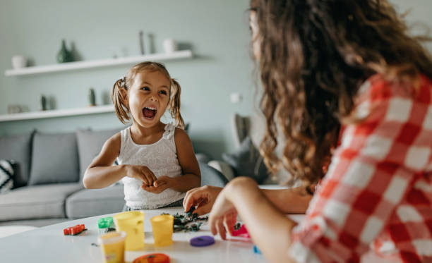 istock Mother is playing with modelling clay with her daughter 1270031802