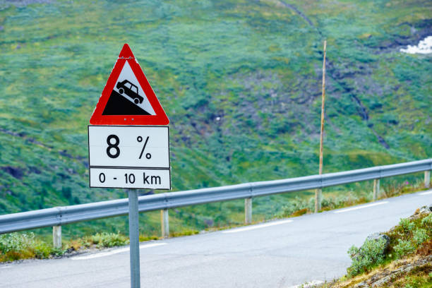 Road sign information about descending the road. Warning of steep descent on the road.
