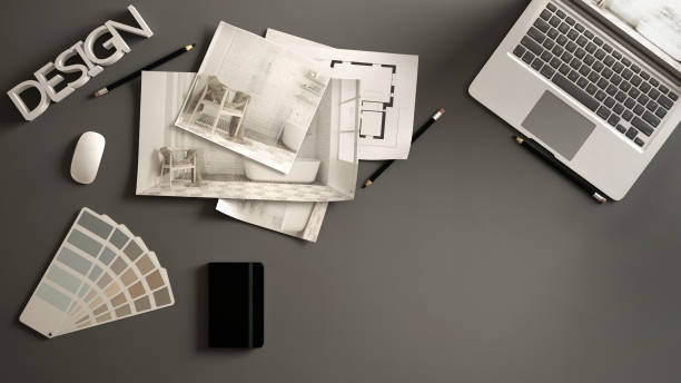 istock Architect designer concept, gray work desk with computer, paper draft, bedroom project images and blueprint. Sample color material palette, creative background idea with copy space 1270034916