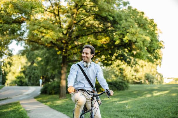 istock Man driving a bike in park 1270035407