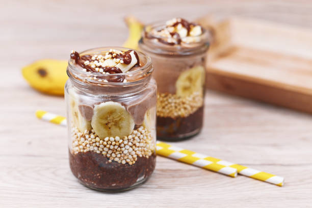 istock Layered dessert with banana fruit slices, puffed quinoa grain and chocolate chia seed pudding 1270036552