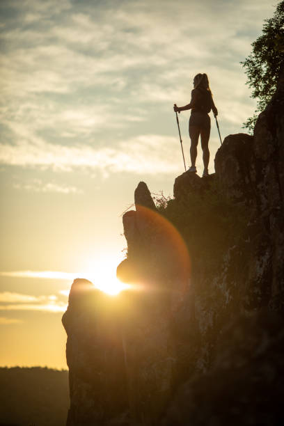 istock Young woman running on mountain 1270036795