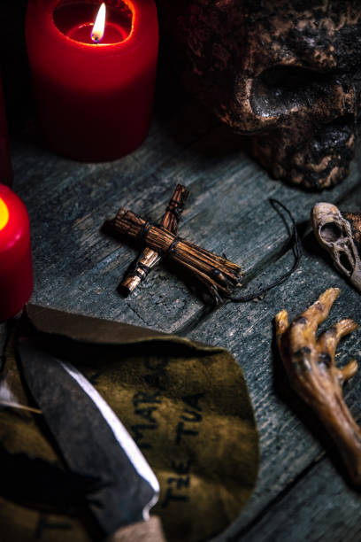 istock Voodoo or vodun death ritual table, human skull, crow´s feet, puppet and knife, african religion and witchcraft 1270037030