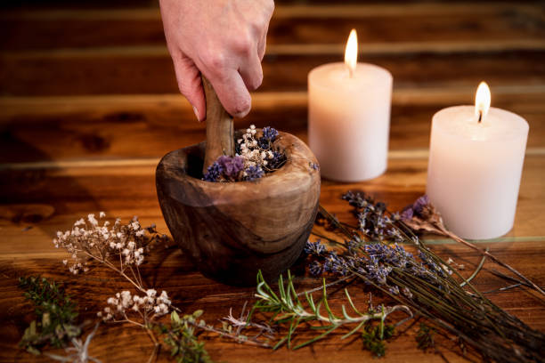 istock Pulverizing healing herbs and flowers with the mortar, esoteric ingredients for a therapy, female hand 1270037065