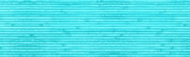Bright turquoise natural bamboo slats texture. Wide horizontal abstract light teal background