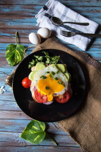 istock Top view of breakfast items poached eggs and vegetables 1270044050