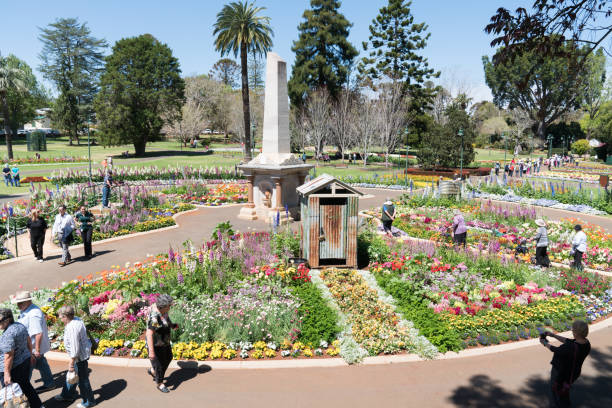 Toowoomba, Australia - September 20, 2018: Visitors enjoying the beautiful floral garden displays in Queens Park during the Carnival of Flowers in Toowoomba, the Garden City