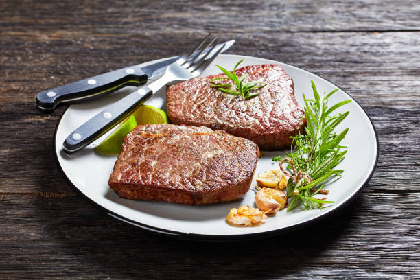istock fried beef steaks with rosemary bouquet, garlic and salt 1270048154