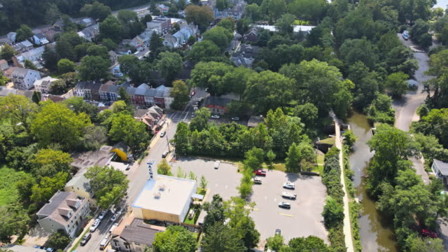 Aerial overhead landscape neighborhood in a small American town of Lambertville New Jersey, view of Delaware river near small town historic New Hope Pennsylvania USA