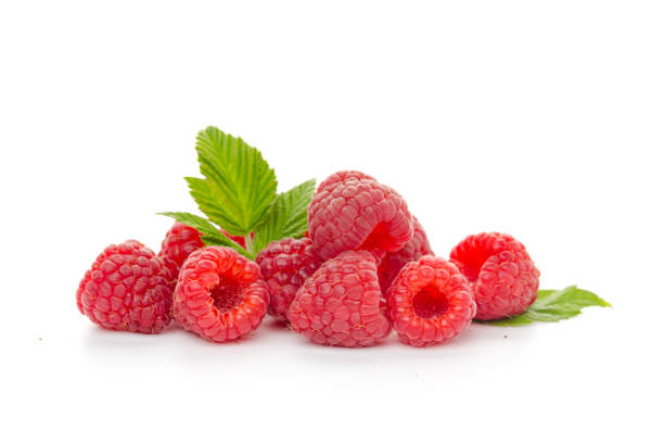 istock Ripe raspberries with leaf isolated on a white background 1270050877