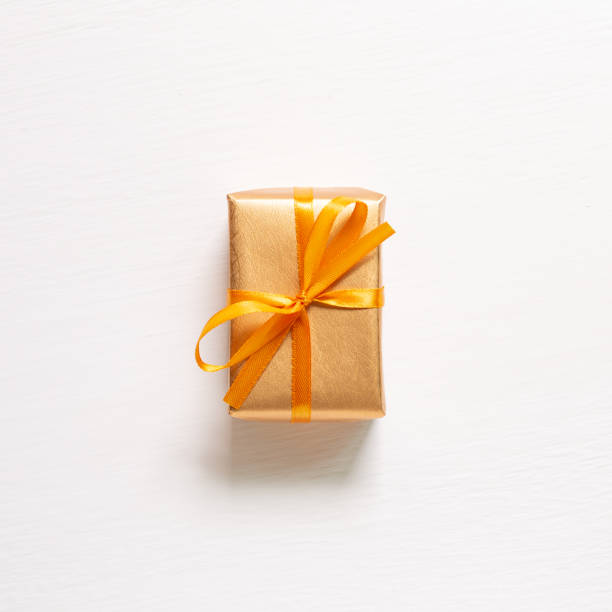 istock Gold gift box isolated on white background. top view 1270052062