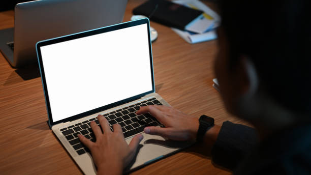istock Cropped shot businessman typing mockup laptop with empty screen. 1270052230