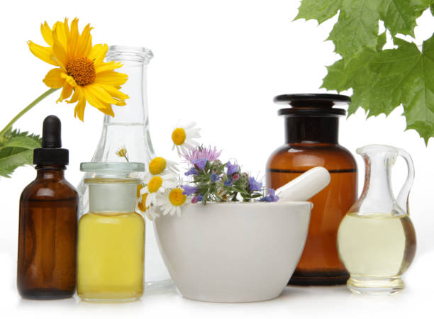 istock Alternative pharmaceuticals, fresh chamomile flowers on white background. 1270053361