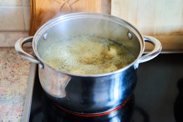 istock Cooking broth in a saucepan on a glass-ceramic plate 1270053737
