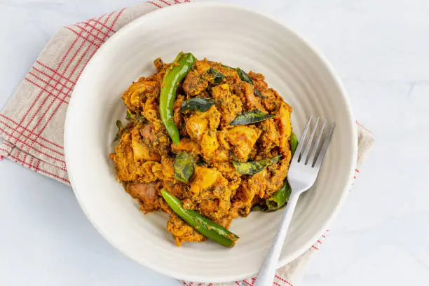 Indian Spiced Chicken Curry on White Background Flat Lay Directly Above Photo