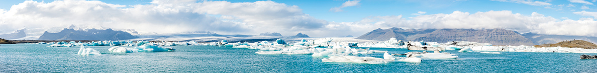 Icebergs floating  in the Jokulsalon glacier lagoon in Iceland during a beautiful sunny day in summer on the South coast of Iceland.