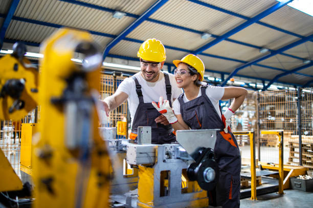 istock Factory production line workers working together in metal industry. 1270058468
