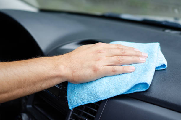 istock Male hand  disinfecting vihicle inside for protection from virus disease 1270060992