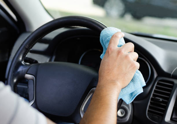 istock Male hand  disinfecting vihicle inside for protection from virus disease 1270061005
