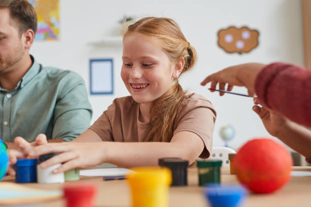 istock Smiling Red Haired Girl in Art Class 1270061054