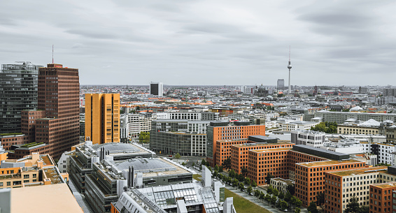 wide panoramic view on Berlin Skyline over modern Potsdamer Platz with Television Tower and Cathedral in the background