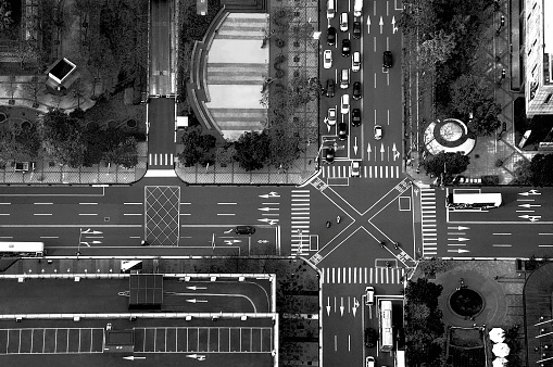 View of the busy intersection of roads with traffic, typical road surface marks