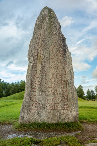 Low angle close up of a large and a thousand year old rune stone in Sweden Close up low angle view of a large and a thousand year old rune stone in Sweden megalith stock pictures, royalty-free photos & images