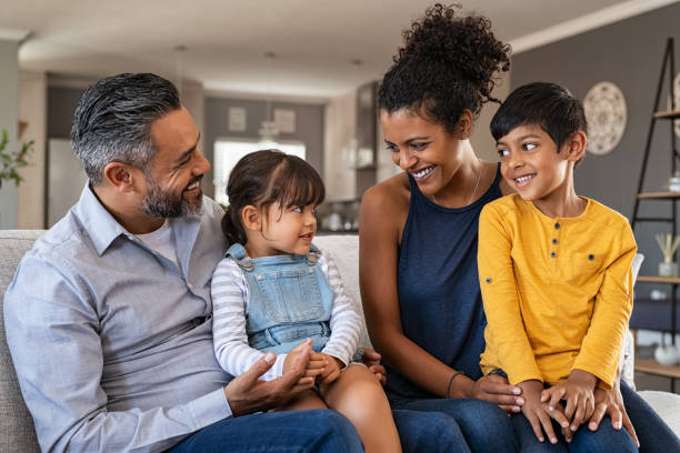 istock Happy ethnic family with two kids on couch 1270066562