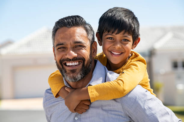 istock Father and son smiling together 1270066720