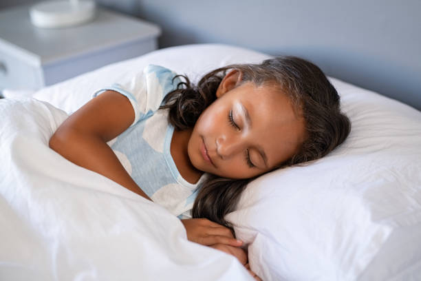 istock Indian little girl sleeping on bed 1270067435
