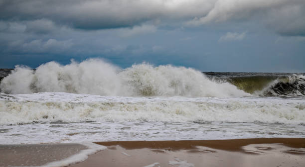 istock Large waves on the beach after a storm 1270068885