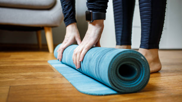 istock Young woman starting her morning yoga routine 1270069132