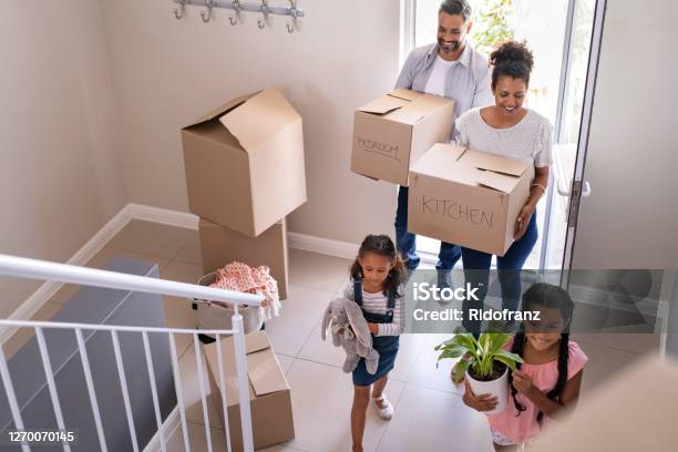 Multiethnic Family Moving In New Home Stock Photo - Download Image Now - Moving House, Family, Relocation
