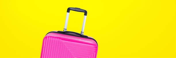 istock banner fuchsia suitcase isolated on blue background 1270070583