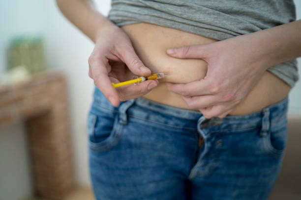 istock Woman Injecting Herself with Insulin 1270075452