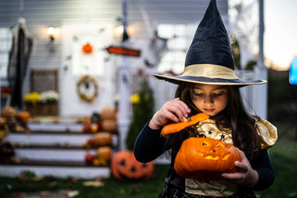 istock A small girl with a pumpkin lantern 1270076125